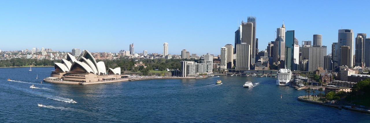 Wide view of Sydney Opera House and surrounding bay and city areas